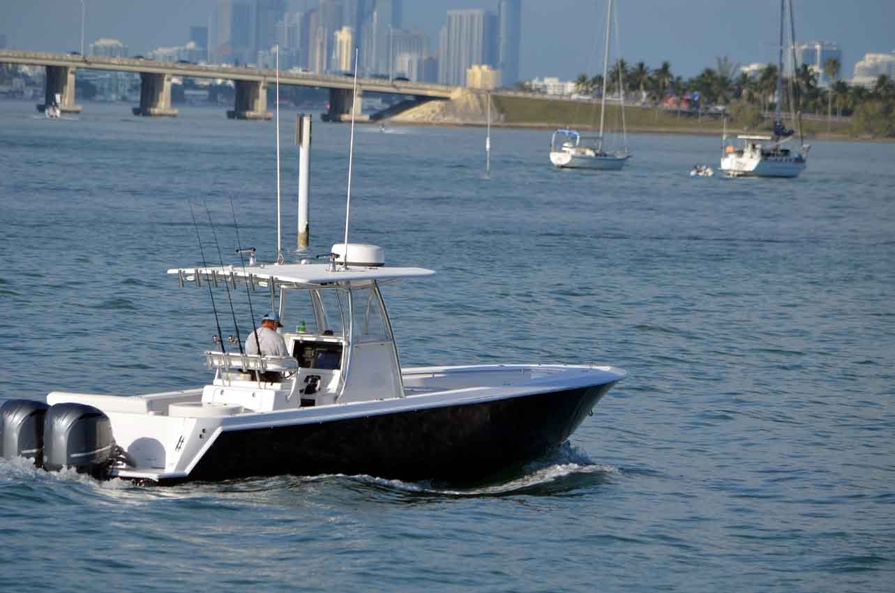 white sport fishing boat off miami beach