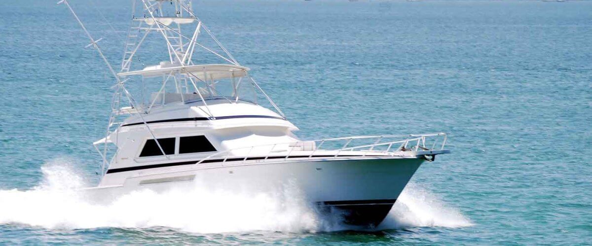 white sport fishing boat sailing on biscayne bay’s waters