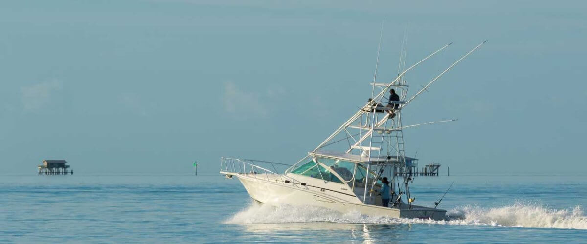 Fishermen driving a power boat in Miami, Florida